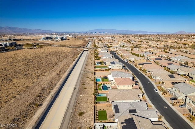 birds eye view of property with a mountain view