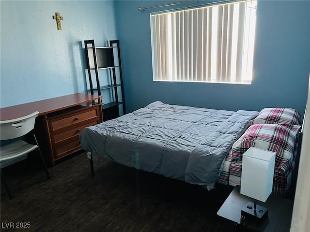 bedroom featuring multiple windows