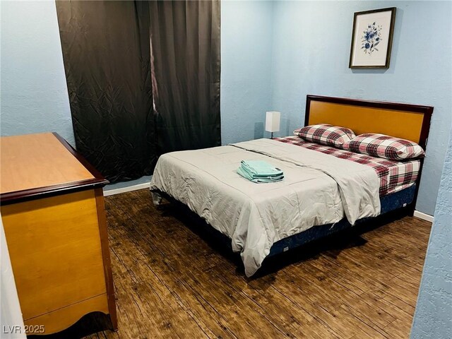 bedroom featuring dark hardwood / wood-style floors