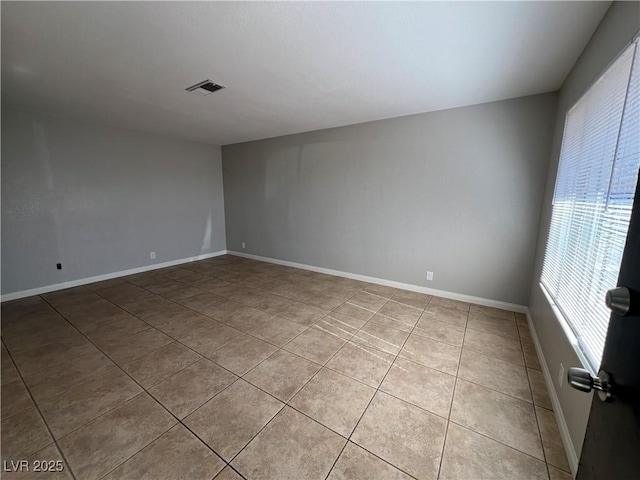 spare room with light tile patterned floors