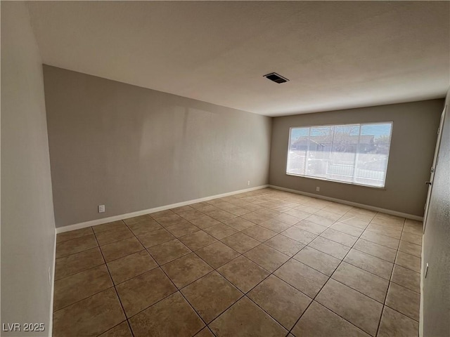 view of tiled spare room