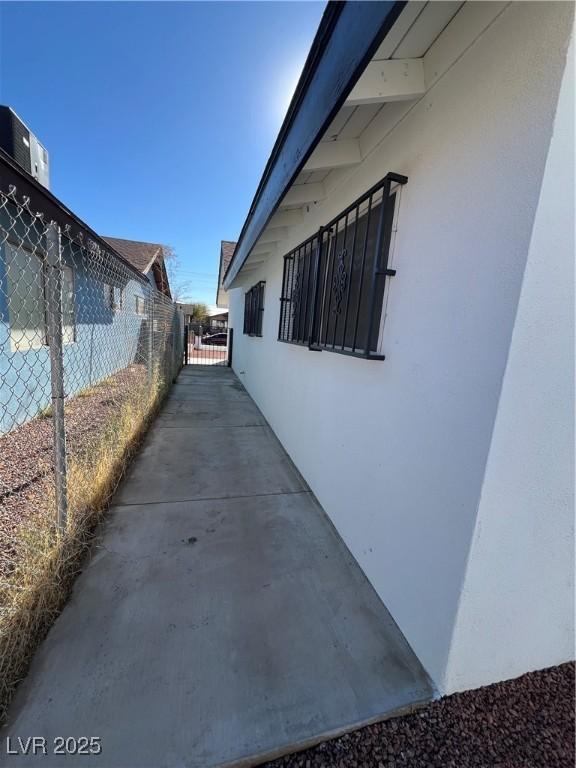 view of side of property with a patio