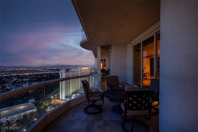 view of balcony at dusk