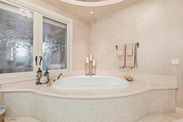 bathroom featuring tiled tub and tile patterned floors