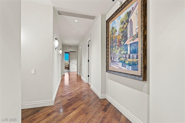 corridor with wood-type flooring