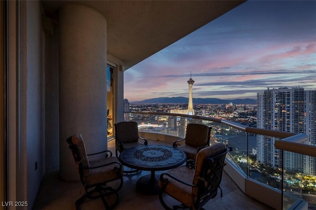 view of balcony at dusk