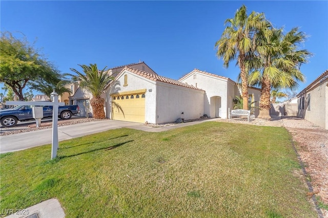 view of front of home with a garage and a front yard