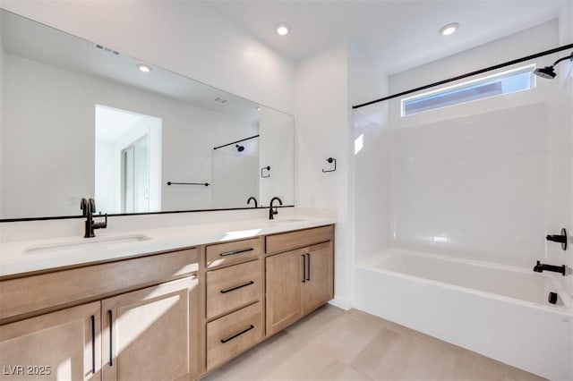 bathroom with vanity and shower / bathing tub combination