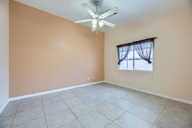 empty room featuring light tile patterned floors and ceiling fan