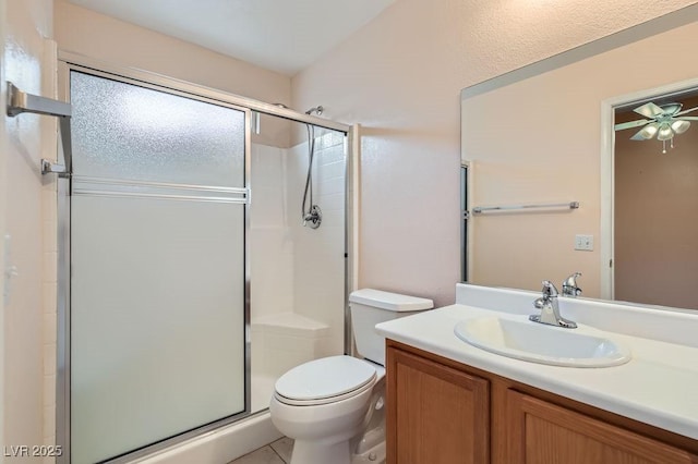 bathroom with an enclosed shower, vanity, and toilet