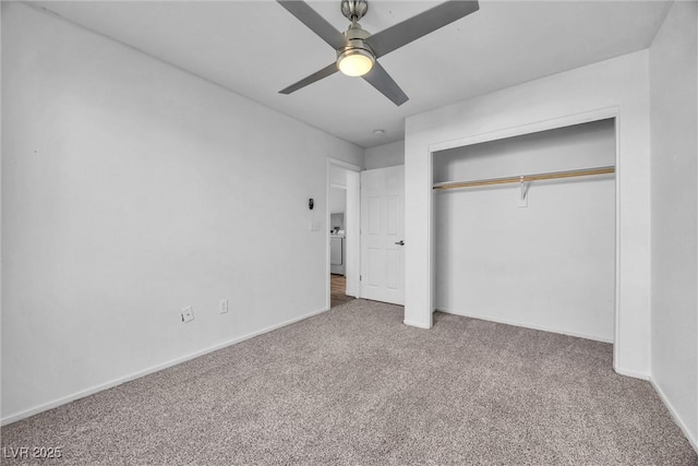 unfurnished bedroom featuring washer / clothes dryer, a closet, ceiling fan, and carpet flooring