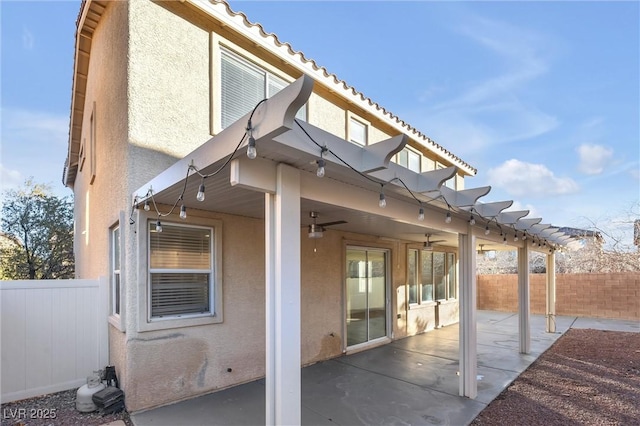 back of house featuring a patio area and ceiling fan