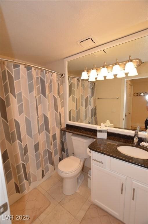 bathroom featuring a shower with curtain, vanity, toilet, and tile patterned flooring