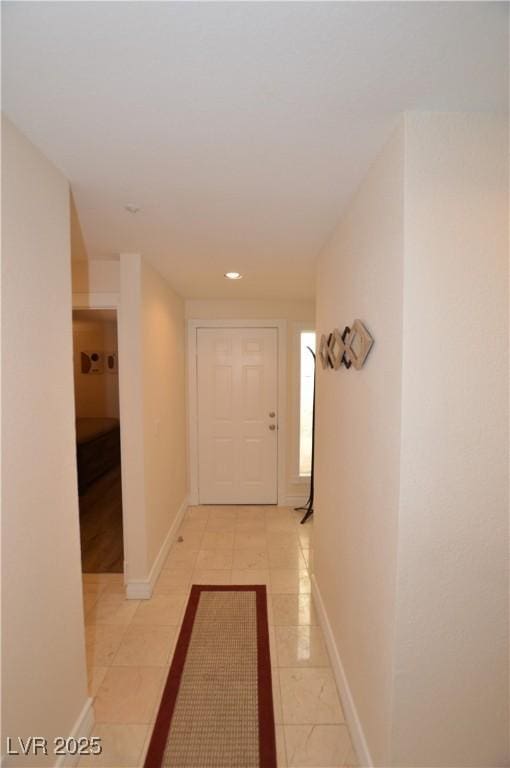 hallway featuring light tile patterned flooring