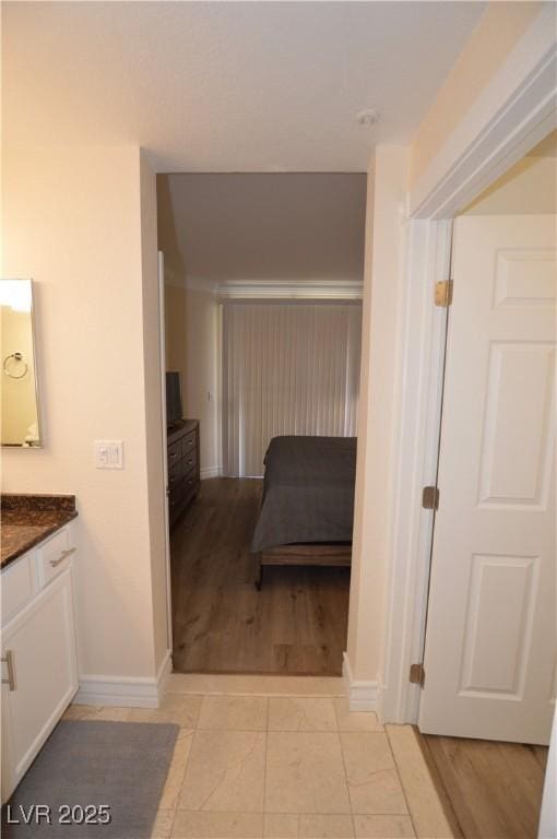 bathroom with tile patterned floors and vanity