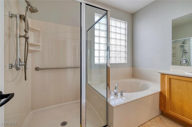 bathroom with vanity, plus walk in shower, and tile patterned flooring