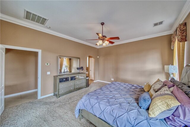 bedroom featuring crown molding, ceiling fan, and light colored carpet