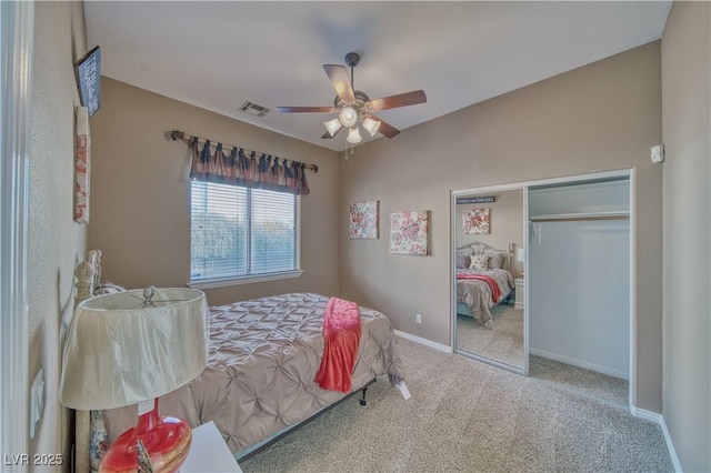 bedroom featuring baseboards, visible vents, ceiling fan, carpet, and a closet