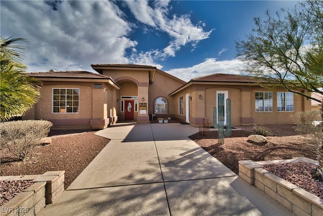 mediterranean / spanish house with stucco siding