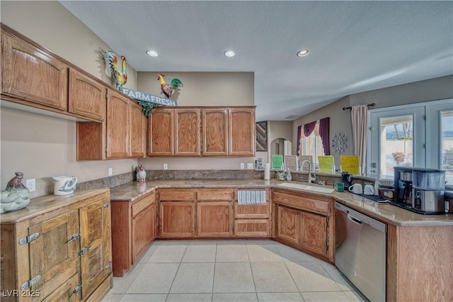 kitchen with light tile patterned flooring, a peninsula, a sink, stainless steel dishwasher, and brown cabinets