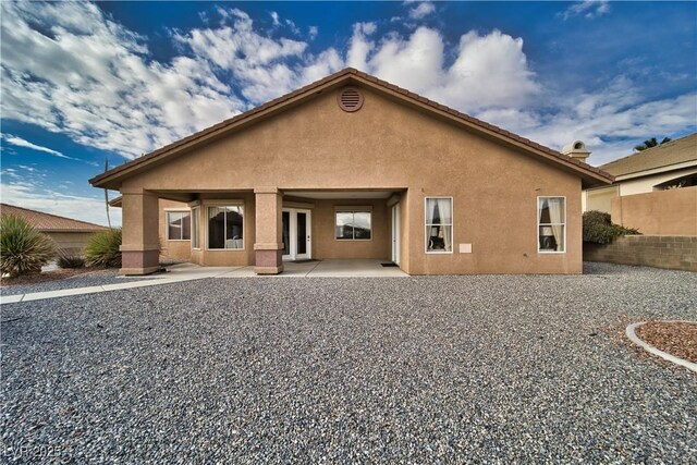 rear view of house featuring a patio area