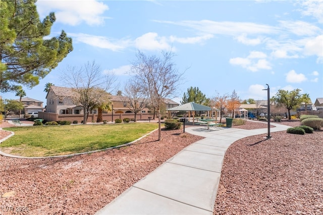 view of home's community featuring a gazebo, a residential view, and a yard