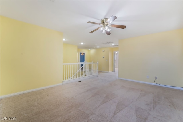 carpeted empty room featuring visible vents, baseboards, ceiling fan, and recessed lighting