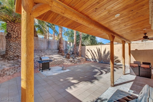 view of patio featuring ceiling fan and a grill