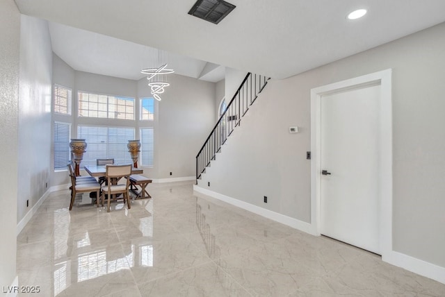 entrance foyer with a notable chandelier