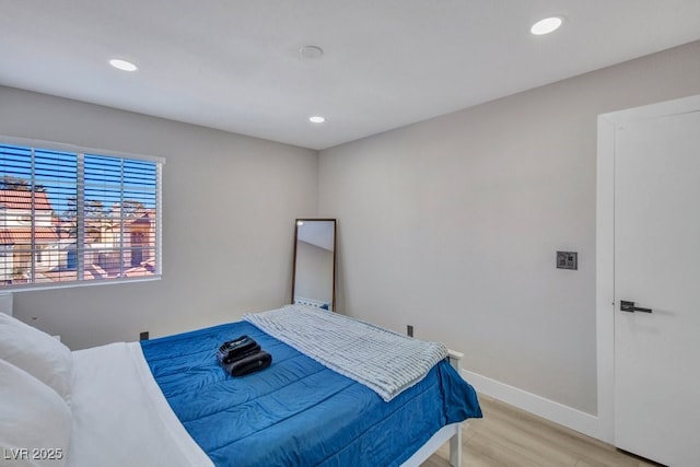 bedroom with light hardwood / wood-style flooring