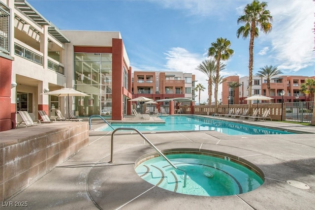 view of pool with a community hot tub and a patio