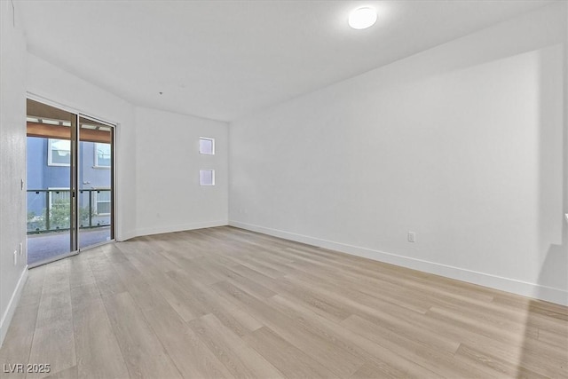 spare room with light hardwood / wood-style floors