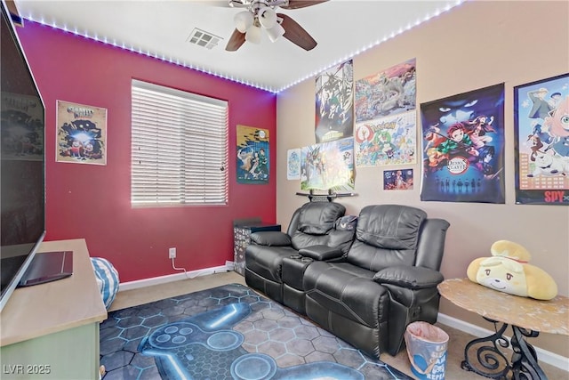 carpeted living room with ceiling fan