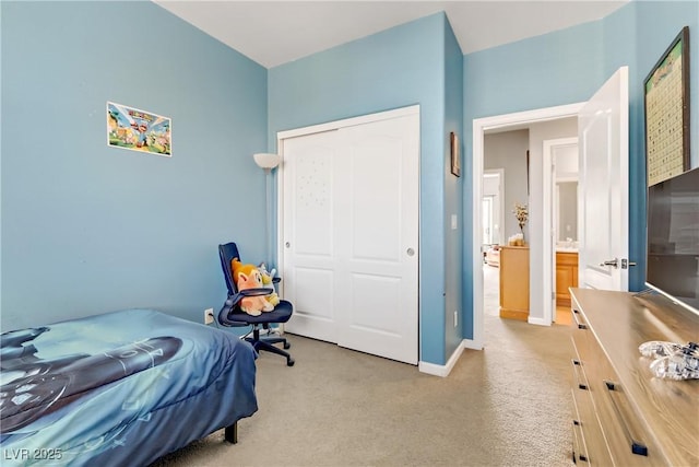 bedroom with light carpet and a closet