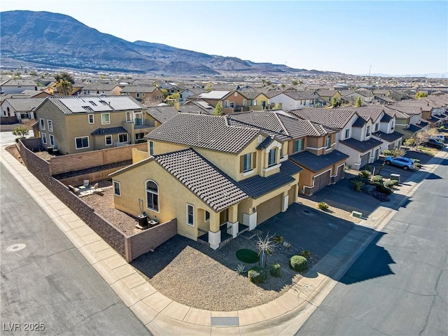 birds eye view of property with a mountain view