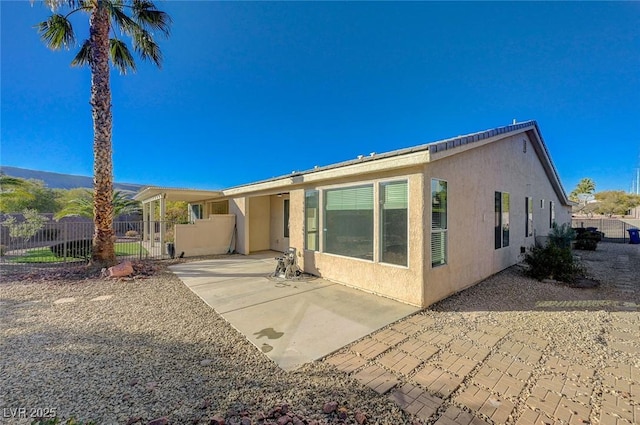 rear view of property with a patio area