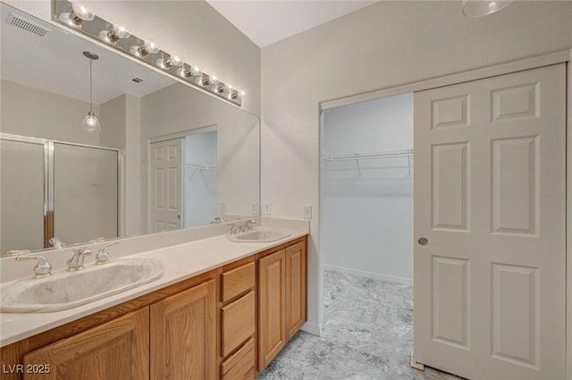 bathroom with vanity and an enclosed shower