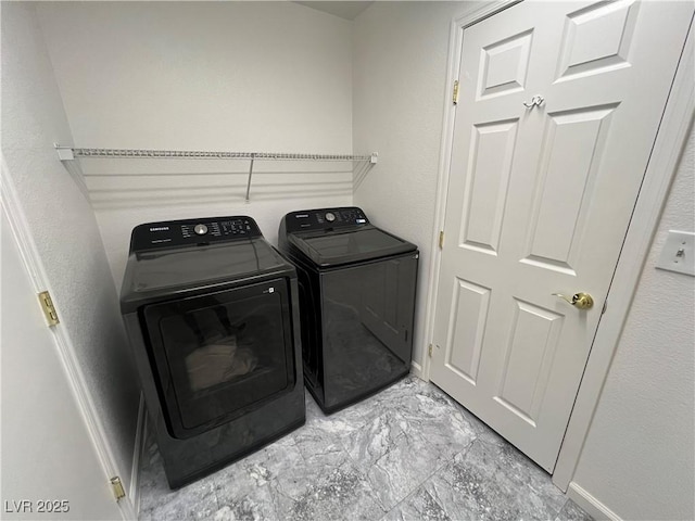 clothes washing area with independent washer and dryer