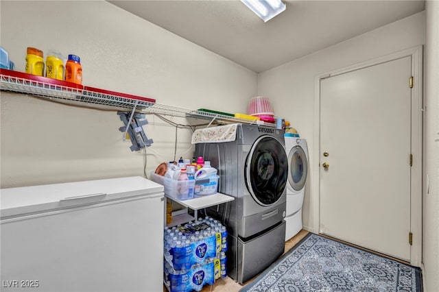 clothes washing area with laundry area and separate washer and dryer