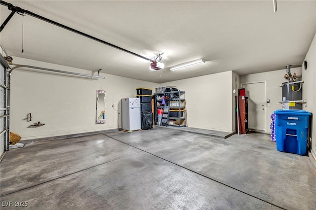 garage featuring a garage door opener and strapped water heater