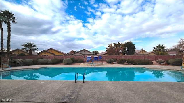 view of pool featuring a fenced in pool, fence, and a patio