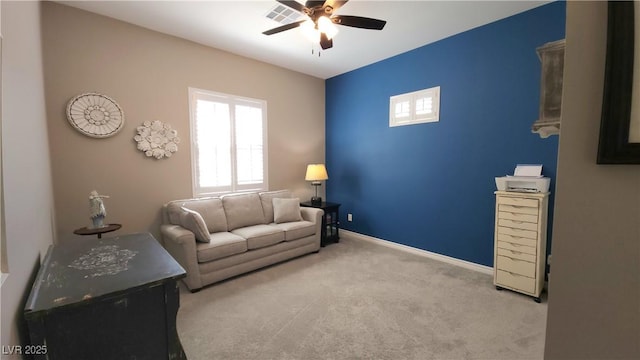 sitting room with ceiling fan, baseboards, carpet flooring, and visible vents