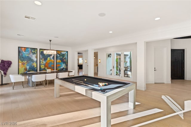 recreation room featuring crown molding, pool table, and light wood-type flooring