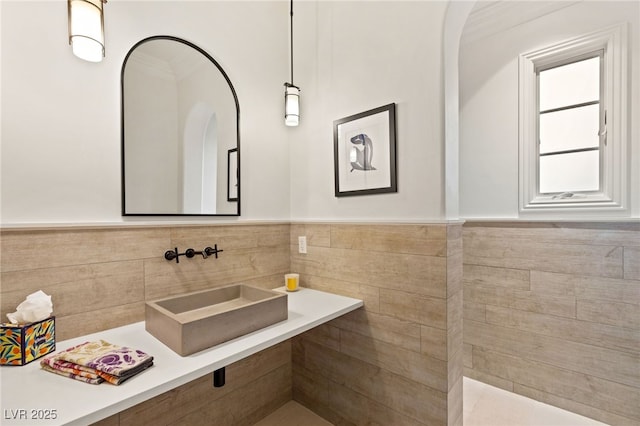 bathroom with sink and crown molding