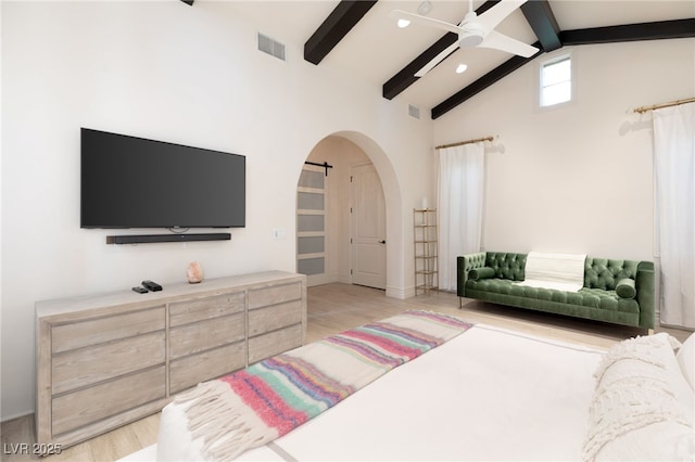 bedroom with beamed ceiling, ceiling fan, high vaulted ceiling, and light hardwood / wood-style floors