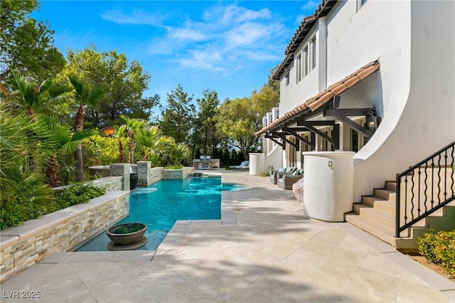 view of swimming pool with a patio area