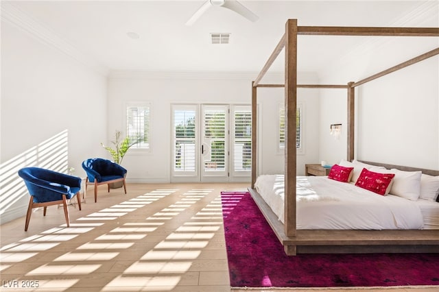 bedroom featuring ornamental molding, access to exterior, ceiling fan, and light hardwood / wood-style flooring