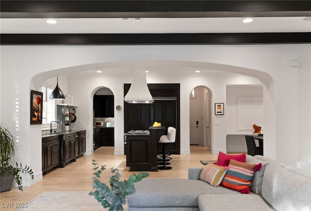 living room featuring sink and light wood-type flooring