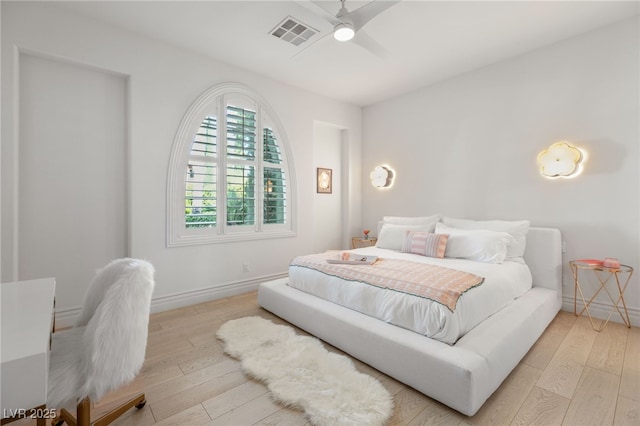 bedroom with light wood-type flooring and ceiling fan