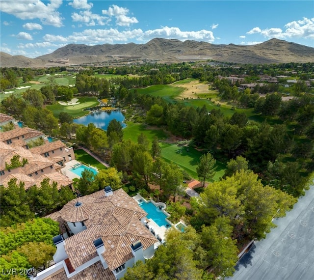 drone / aerial view featuring a water and mountain view